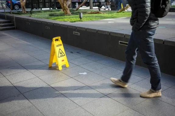 caution sign with a person walking